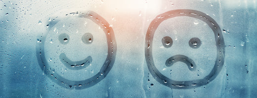 happy face and smiley face drawn in condensation