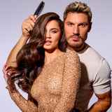 chris appleton holding a brush up to a model with brown hair