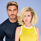 Man and woman standing side by side against a light blue background