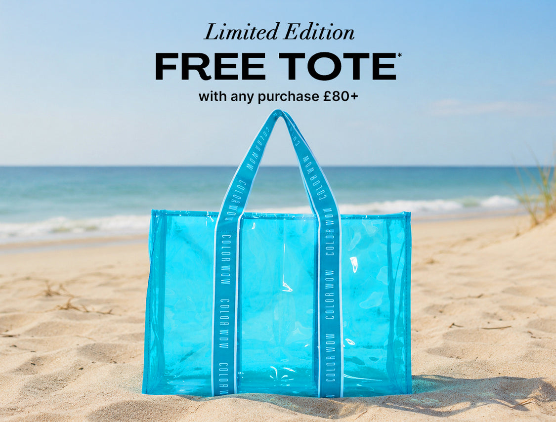 Color Wow Limited Edition Free Tote promotional banner. Offer: Get a free blue beach tote with any purchase of 80 pounds or more. Visual features the transparent blue tote sitting on a sandy beach by the ocean.